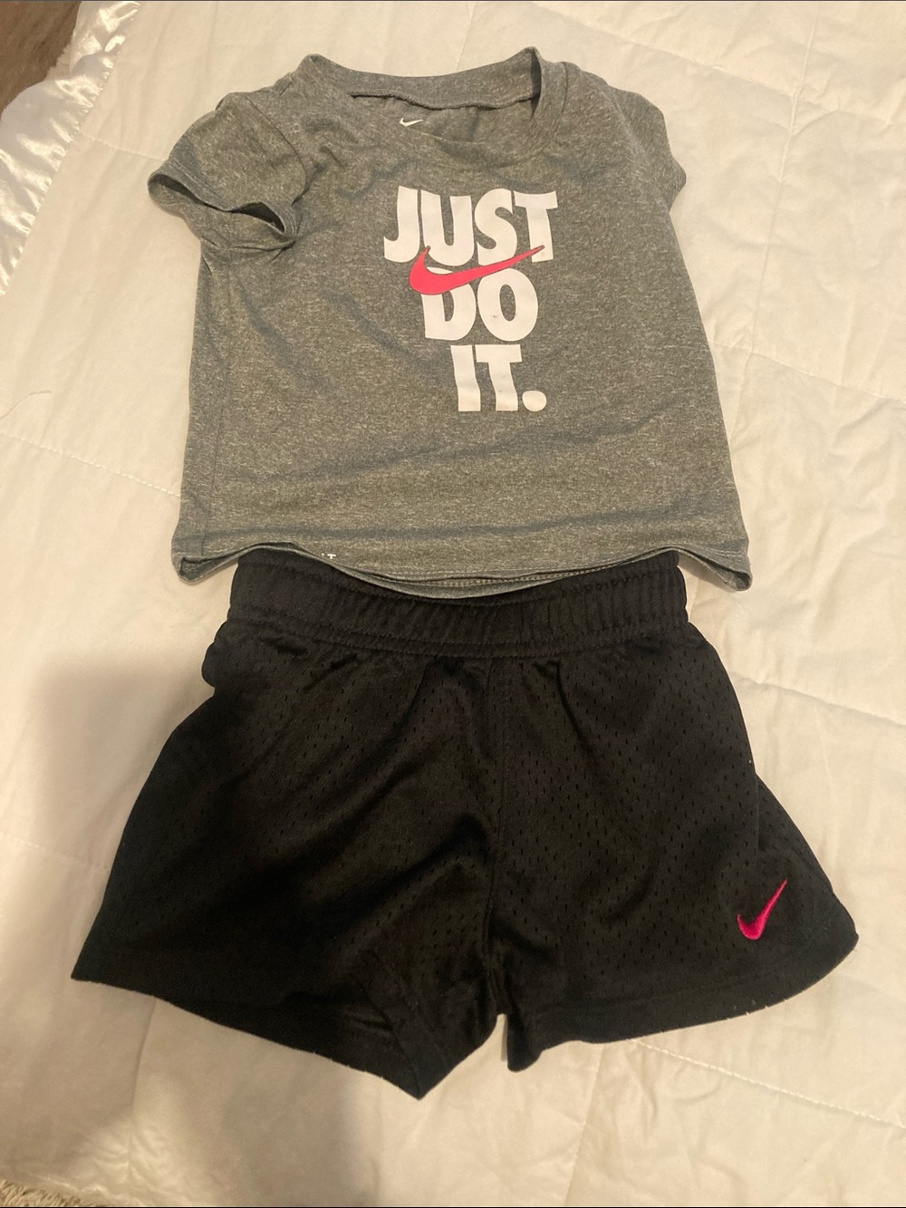 Nike Black Mesh Athletic Shorts with Pink Swoosh